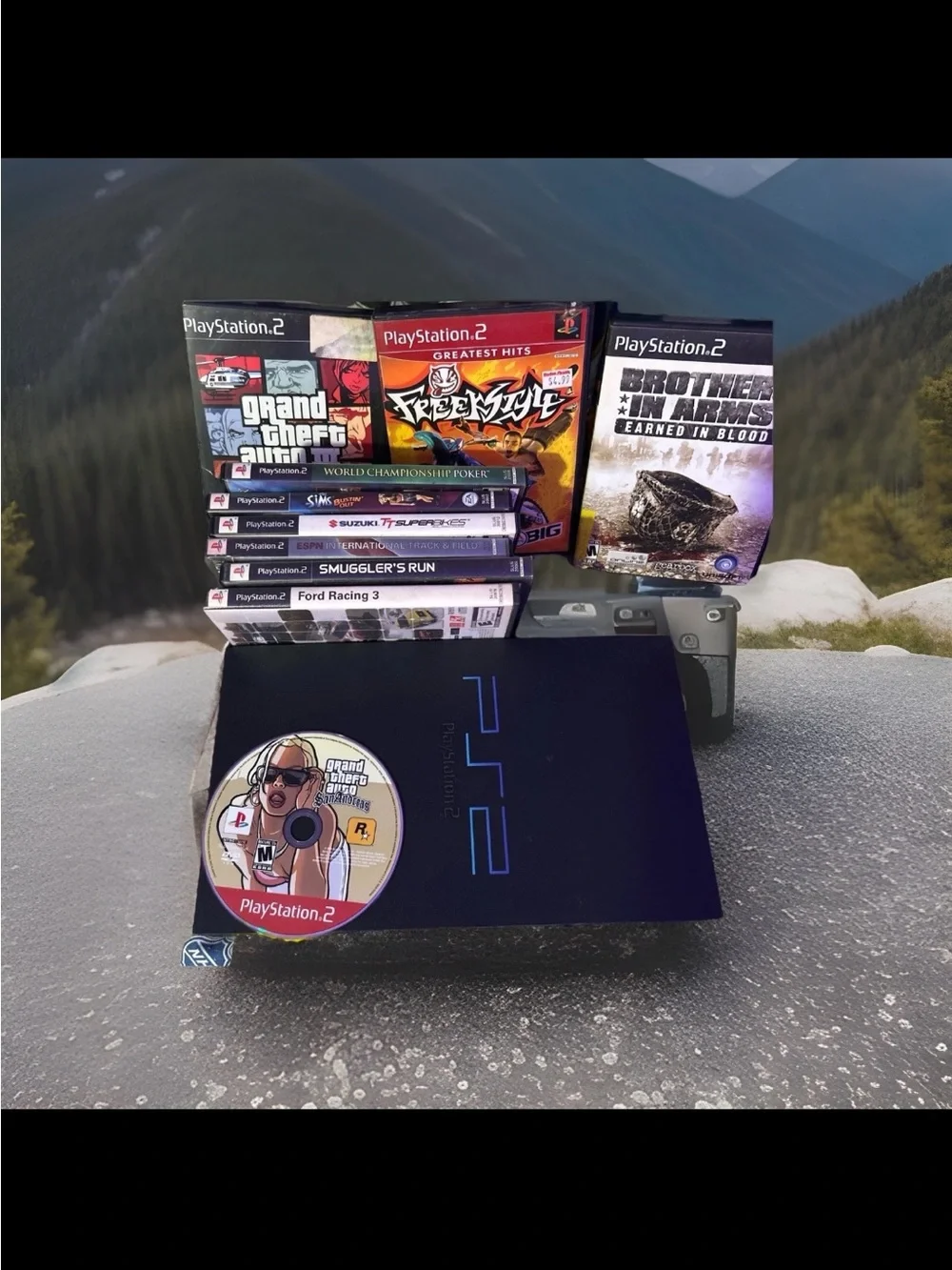 Sony PlayStation 2 Slim Bundle with Black Console and Multicolored Game Discs